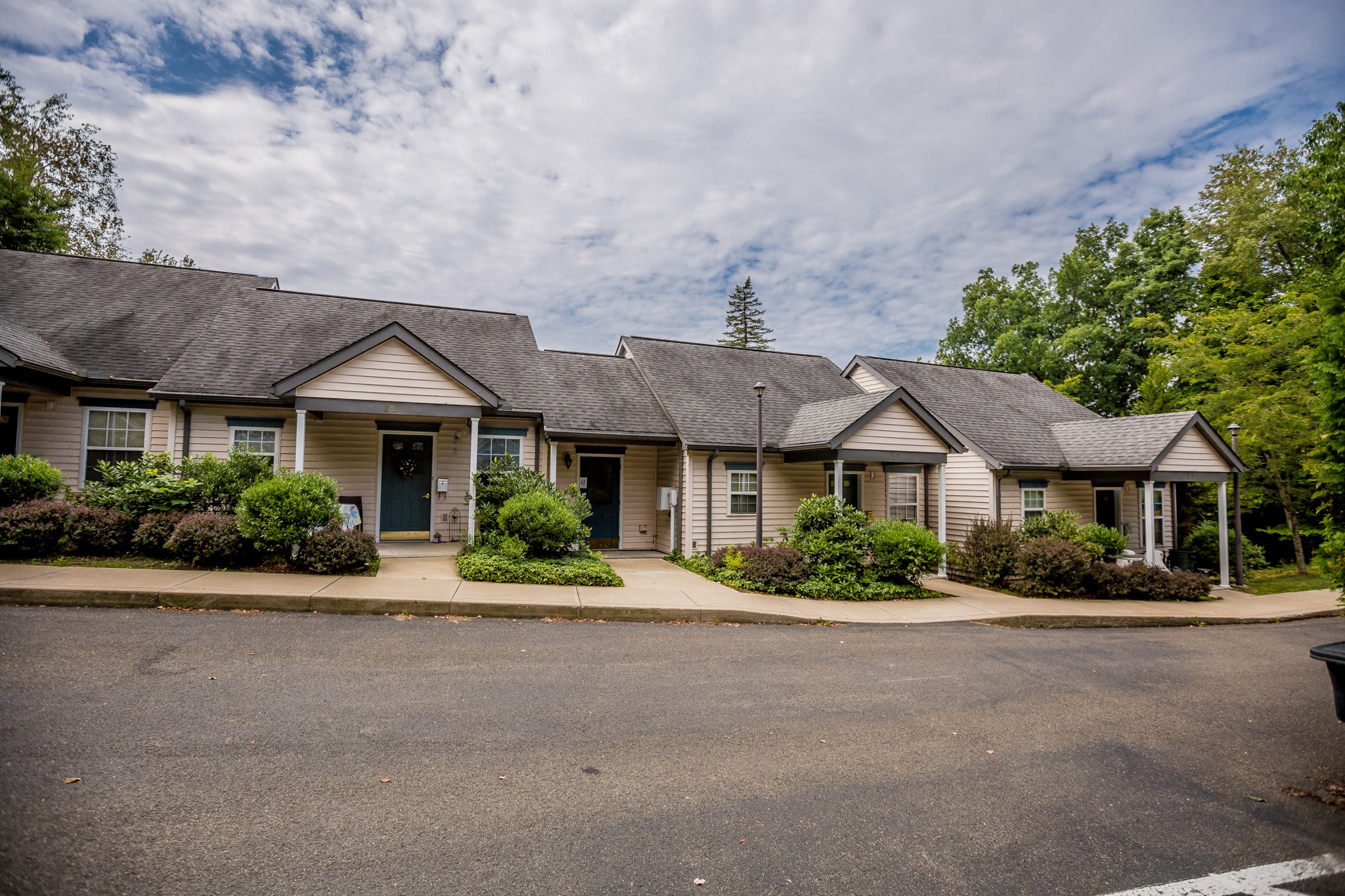 a home with a street in front of it